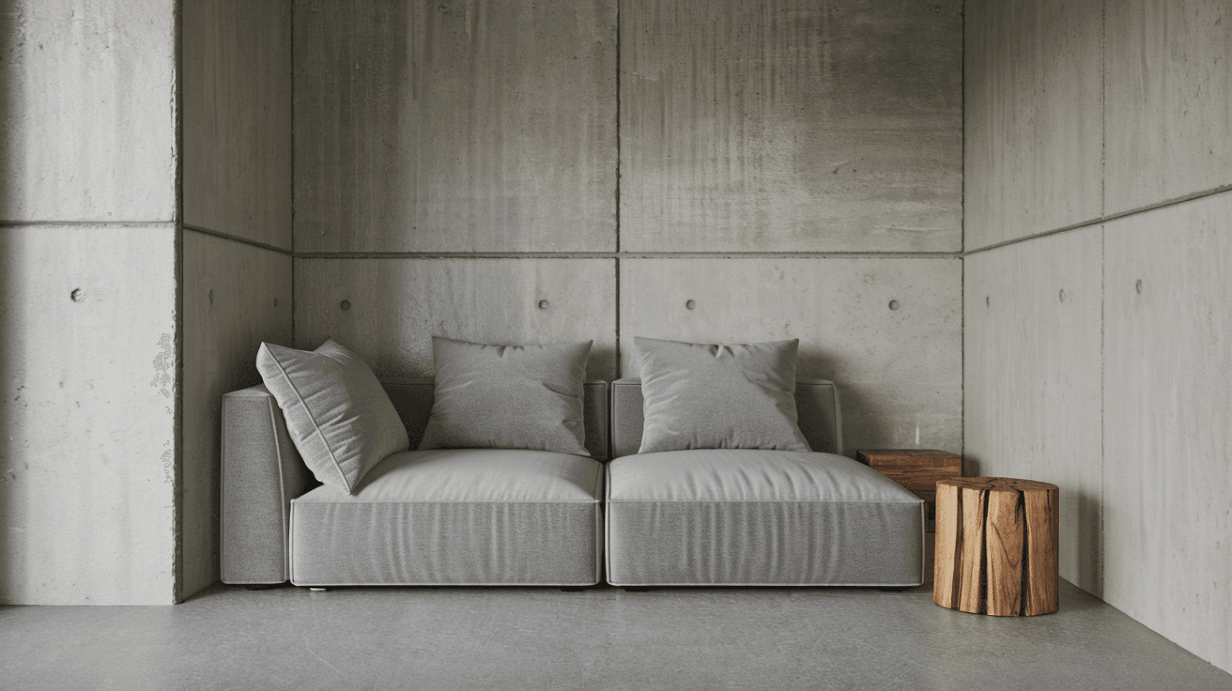 Gray sofa against concrete wall